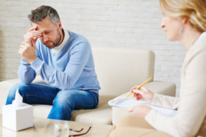 a man discusses a personality disorder treatment program with a therapist