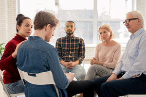 a group therapy session in an aftercare program