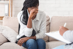 a woman learning about benzo addiction treatment program