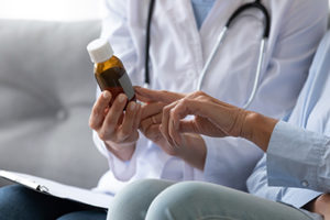 a doctor talking to a patient about prescription drug addiction treatment program