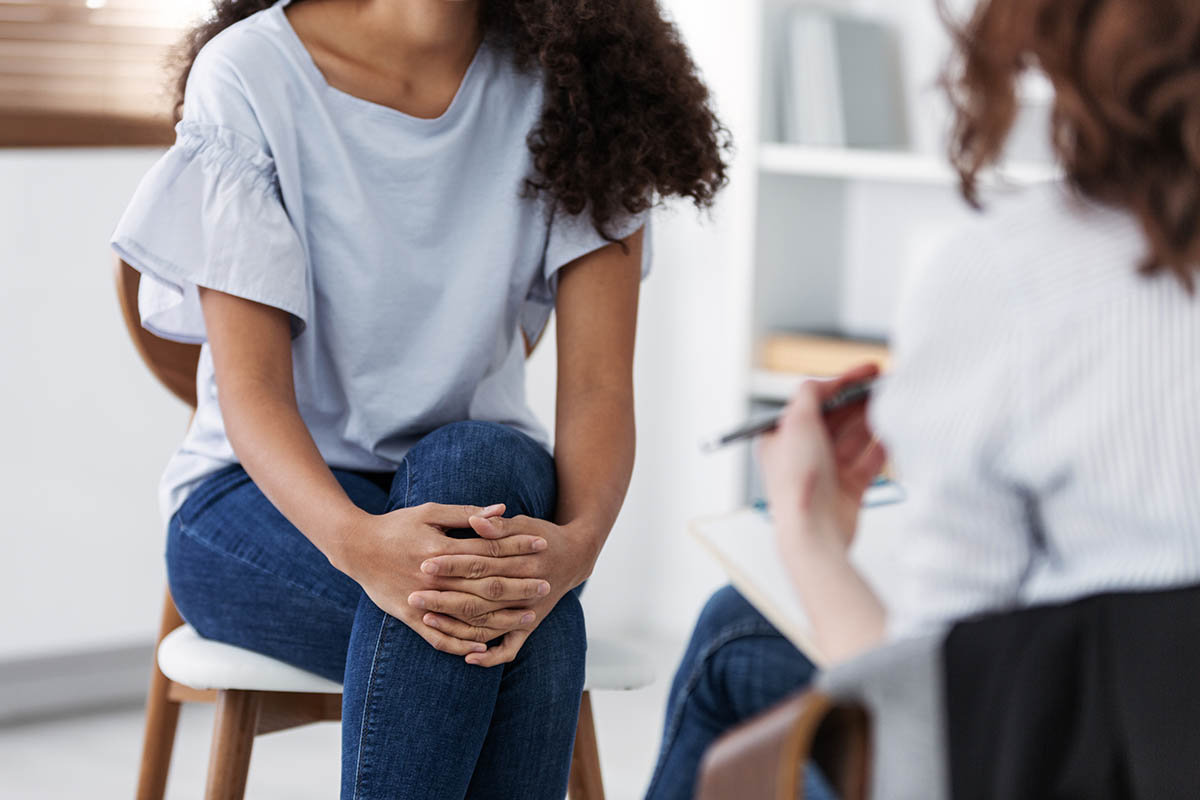 a patient talking to her doctor about trauma informed care for a loved one