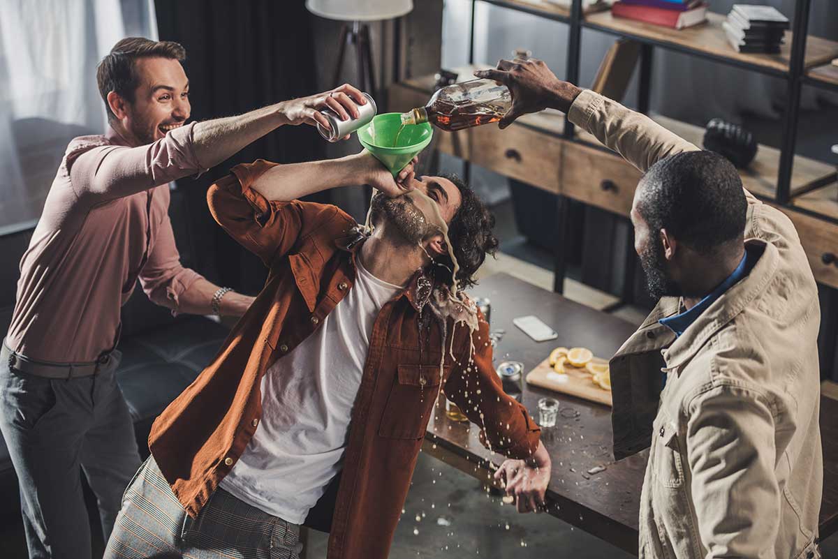 a group of students binge drinking